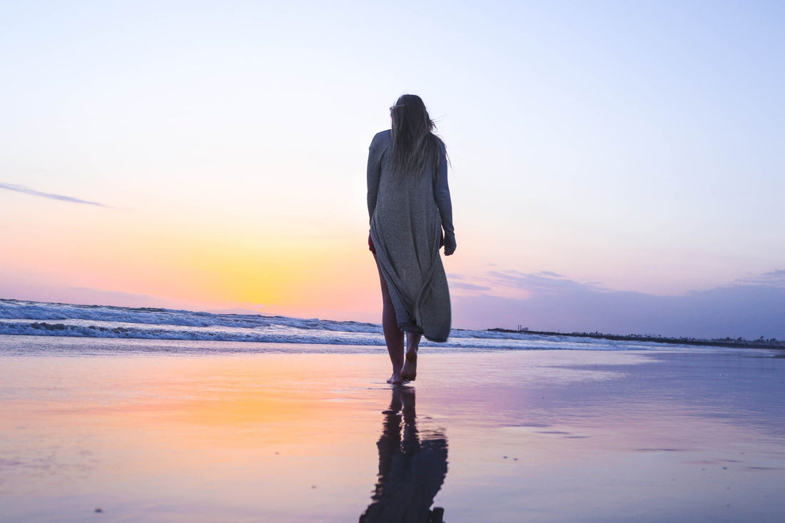 woman walking on beach